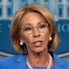 Why has Betsy DeVos submitted her resignation?