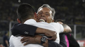 Rosario Central's coach Miguel Angel Russo (R) celebrates with a team member after defeating River Plate during the penalty shoot-out of the Argentine Professional Football League Cup semifinal football match at the Mario Kempes stadium in Cordoba, Argentina, on December 9, 2023. Rosario Central and Platense will play the final at Madre de Ciudades stadium in Santiago del Estero on December 16. (Photo by DIEGO HALIASZ / AFP)