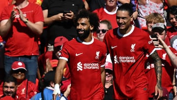 Liverpool's Egyptian striker #11 Mohamed Salah (L) and Liverpool's Uruguayan striker #09 Darwin Nunez (R) celebrate after an own goal from Aston Villa's English defender #02 Matty Cash makes it 2-0 during the English Premier League football match between Liverpool and Aston Villa at Anfield in Liverpool, north-west England on September 3, 2023. (Photo by Paul ELLIS / AFP)