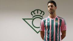 Betis player Cejudo with the special pink & green commemorative shirt