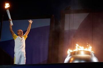 Vanderlei de Lima reacts after lighting the Olympic Cauldron.