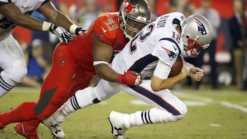 Oct 5, 2017; Tampa, FL, USA; Tampa Bay Buccaneers defensive tackle Gerald McCoy (93) sacks New England Patriots quarterback Tom Brady (12) during the first half at Raymond James Stadium. Mandatory Credit: Kim Klement-USA TODAY Sports