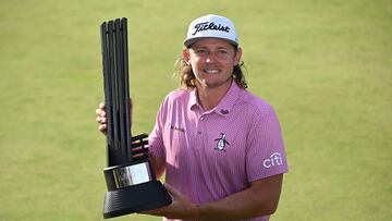 Australia's Cameron Smith poses on the 18th green with the winner's trophy on the final day of the LIV Golf Invitational Series event at The Centurion Club in St Albans, north of London, on July 9, 2023. (Photo by JUSTIN TALLIS / AFP)