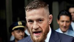 (FILES) This file photo taken on July 26, 2018 shows Irish mixed martial arts superstar Conor McGregor talking to the press after he pleaded guilty to a single violation of disorderly conduct, in Brooklyn Criminal Court. - Conor McGregor was taken into cu