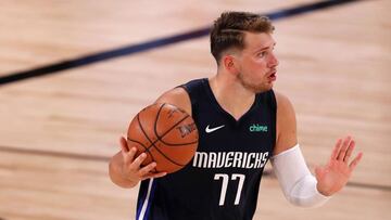 LAKE BUENA VISTA, FLORIDA - JULY 31: Luka Doncic #77 of the Dallas Mavericks dribbles during overtime against the Houston Rockets at The Arena at ESPN Wide World Of Sports Complex on July 31, 2020 in Lake Buena Vista, Florida. NOTE TO USER: User expressly acknowledges and agrees that, by downloading and or using this photograph, User is consenting to the terms and conditions of the Getty Images License Agreement.   Mike Ehrmann/Getty Images/AFP
 == FOR NEWSPAPERS, INTERNET, TELCOS &amp; TELEVISION USE ONLY ==