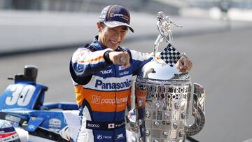Aug 24, 2020; Indianapolis, Indiana, USA; IndyCar driver Takuma Sato (30) poses for a photo with the Borg-Warner Trophy during a photo shoot after winning the 2020 Indianapolis 500 at the Indianapolis Motor Speedway. Mandatory Credit: Brian Spurlock-USA TODAY Sports