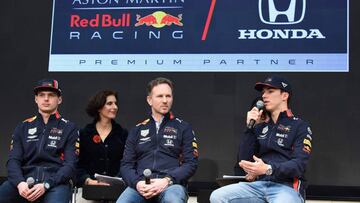 Aston Martin Red Bull Racing driver Pierre Gasly (R) speaks during a talk session for the media at Hononda Motor's headquarters in Tokyo on March 9, 2019 while his teammate Max Verstappen (L) and team principal Christian Horner (C) look on. - The season-opening Australian Grand Prix will be held on March 17. (Photo by Kazuhiro NOGI / AFP)