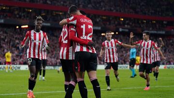 Athletic Bilbao's Spanish forward #12 Gorka Guruzeta celebrates scoring his team's third goal with Athletic Bilbao's Spanish defender #32 Adama Boiro (L) during the UEFA Europa League 1st round day 5 football match between Athletic Club Bilbao and IF Elfsborg at the San Mames stadium in Bilbao on November 28, 2024. (Photo by CESAR MANSO / AFP)