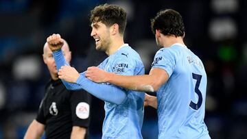 John Stones y R&ugrave;ben Dias.