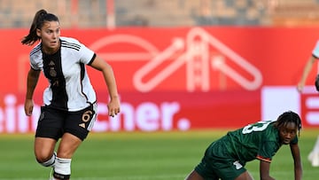 Germany's midfielder Lena Oberdorf (L) plays the ball next to Zambia's forward Ochumba Lubandji during the International friendly football match Germany vs Zambia in Fuerth, southern Germany, on July 7, 2023, ahead of the FIFA Women's World Cup. (Photo by CHRISTOF STACHE / AFP)