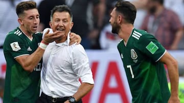 Osorio (centre) celebrates with Héctor Herrera (left) and Miguel Layún after Mexico's 1-0 win over Germany at this summer's World Cup.