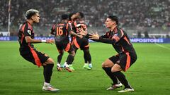 Colombia's forward Luis Diaz (L) celebrates with teammate  midfielder James Rodriguez after scoring during the 2026 FIFA World Cup South American qualifiers football match between Peru and Colombia, at the Monumental stadium in Lima, on September 6, 2024. (Photo by ERNESTO BENAVIDES / AFP)