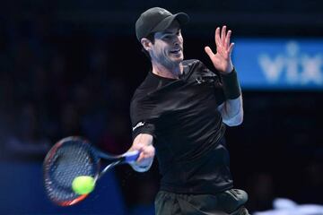 Britain's Andy Murray returns against Switzerland's Stan Wawrinka.