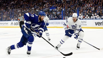 May 12, 2022; Tampa, Florida, USA; Tampa Bay Lightning defenseman Victor Hedman (77) skates with the puck as Toronto Maple Leafs center Auston Matthews (34) defends during the first period of game six of the first round of the 2022 Stanley Cup Playoffs at Amalie Arena. Mandatory Credit: Kim Klement-USA TODAY Sports