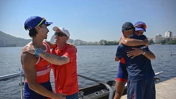 Chile's Cesar Abaroa (L) and Eber Sanhueza (R-back) celebrate after winning during the Lightweight Men's Double Sculls LM2X final of the Americas Olympic