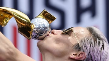 (FILES) In this file photo taken on July 10, 2019 USA women&#039;s soccer player Megan Rapinoe kisses the trophy in front of the City Hall after the ticker tape parade for the women&#039;s World Cup champions in New York. - The US national women&#039;s te