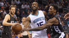 Feb 7, 2017; Charlotte, NC, USA; Charlotte Hornets guard Kemba Walker (15) is fouled by Brooklyn Nets forward Rondae Hollis-Jefferson (24) during the first half of the game at the Spectrum Center. Mandatory Credit: Sam Sharpe-USA TODAY Sports