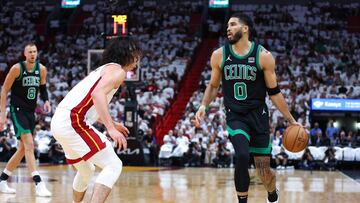 MIAMI, FLORIDA - APRIL 27: Jayson Tatum #0 of the Boston Celtics dribbles the ball against Jaime Jaquez Jr. #11 of the Miami Heat during the first quarter in game three of the Eastern Conference First Round Playoffs at Kaseya Center on April 27, 2024 in Miami, Florida. NOTE TO USER: User expressly acknowledges and agrees that, by downloading and or using this photograph, User is consenting to the terms and conditions of the Getty Images License Agreement. Megan Briggs/Getty Images/AFP (Photo by Megan Briggs / GETTY IMAGES NORTH AMERICA / Getty Images via AFP)