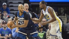 Mar 11, 2018; Minneapolis, MN, USA; Minnesota Timberwolves forward Taj Gibson (67) looks to pass the ball around Golden State Warriors forward Kevin Durant (35) in the first half at Target Center. Mandatory Credit: Jesse Johnson-USA TODAY Sports