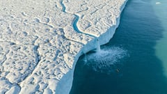 Aniol Serrasolses paddles the river on the Austfonna ice cap, Svalbard on August 6, 2023