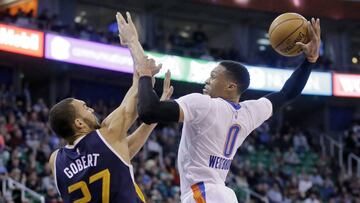 Utah Jazz center Rudy Gobert (27) defends against Oklahoma City Thunder guard Russell Westbrook (0) in the second quarter during a NBA basketball game, Monday, Jan. 23, 2017, in Salt Lake City. (AP Photo/Rick Bowmer)