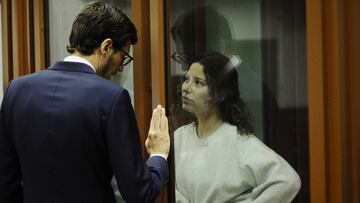 Russian-American dual citizen Ksenia Karelina, accused of treason for making a donation to a charity supporting Ukraine, listens to her lawyer Mikhail Mushailov as they attend a court hearing in Yekaterinburg, Russia August 15, 2024. REUTERS/Dmitry Chasovitin