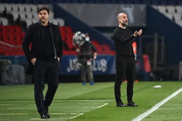 Manchester City's Spanish manager Pep Guardiola gives his instructions (R) next to Paris Saint-Germain's Argentinian head coach Mauricio Pochettino during the UEFA Champions League first leg semi-final football match between Paris Saint-Germain (PSG) and 