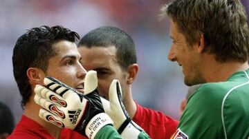 Edwin van der Sar in his playing days at Man United, with Cristiano Ronaldo.