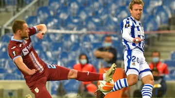 HNK Rijeka&#039;s Croatian defender Ivan Tomecak (L) tackles Real Sociedad&#039;s Spanish defender Nacho Monreal during the UEFA Europa League group F football match between Real Sociedad and Rijeka at the Anoeta stadium in San Sebastian on December 3, 20