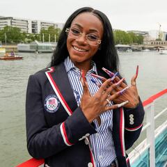 Sha'Carri Richardson poses for a photo while riding on a boat with teammates along the Seine River in Paris, France, during the opening ceremony of the 2024 Summer Olympics, Friday, July 26, 2024. (Photo by Ashley Landis / POOL / AFP)