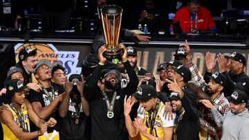 Dec 9, 2023; Las Vegas, Nevada, USA; Los Angeles Lakers forward LeBron James (23) hoists the NBA Cup and celebrates with teammates after winning the NBA In-Season Tournament Championship game against the Indiana Pacers at T-Mobile Arena. Mandatory Credit: Candice Ward-USA TODAY Sports