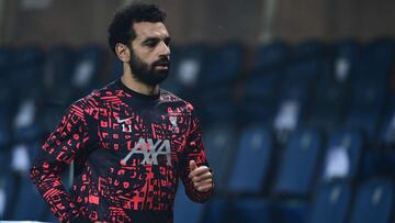 (FILES) A file photo taken on November 03, 2020 shows Liverpool's Egyptian midfielder Mohamed Salah warming up ahead of the UEFA Champions league football match Atalanta Bergamo vs Liverpool, at the Atalanta stadium in Bergamo. - Salah has tested pos