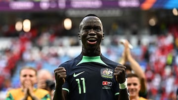 Australia's forward #11 Awer Mabil celebrates after winning the Qatar 2022 World Cup Group D football match between Tunisia and Australia at the Al-Janoub Stadium in Al-Wakrah, south of Doha on November 26, 2022. (Photo by Anne-Christine POUJOULAT / AFP)