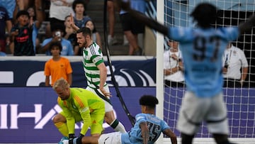 Manchester City's English midfielder #75 Nico O'Reilly vies for the ball with Celtic's Danish goalkeeper #01 Kasper Schmeichel during the 2024 FC Series pre-season friendly football match between Manchester City and Celtic at the Kenan Memorial Stadium in Chapel Hill, North Carolina, July 23, 2024. (Photo by Peter Zay / AFP)