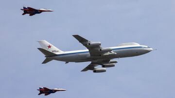 A Russian Il-80 military transport aircraft, also known as the Doomsday plane, and MiG-29 fighter jets fly in formation during a rehearsal for a flypast, part of a military parade marking the anniversary of the victory over Nazi Germany in World War Two, 