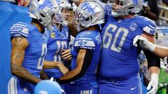 Jared Goff #16 of the Detroit Lions celebrates with teammates