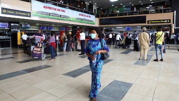 FILE PHOTO: A woman wears a protective face mask at the Murtala Mohammed International airport in Lagos, Nigeria March 19, 2020. Picture taken March 19, 2020. REUTERS/Temilade Adelaja/File Photo