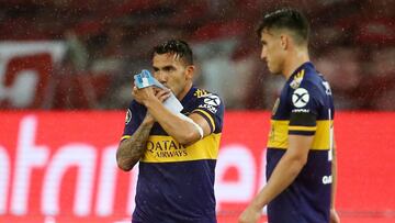 Soccer Football - Copa Libertadores - Round of 16 - First Leg - Internacional v Boca Juniors - Beira Rio Stadium, Porto Alegre, Brazil - December 2, 2020 Boca Juniors' Carlos Tevez celebrates scoring their first goal kissing his captain's bracelet with the image of Diego Maradona Pool via REUTERS/Diego Vara