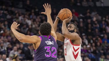 Feb 13, 2019; Minneapolis, MN, USA; Houston Rockets guard James Harden (13) shoots the ball over Minnesota Timberwolves center Karl-Anthony Towns (32) in the first half at Target Center. Mandatory Credit: Jesse Johnson-USA TODAY Sports