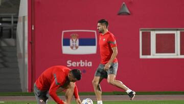 Serbia's forward Dusan Tadic (R) takes part in a training session at the Al Arabi SC in Doha on December 1, 2022, on the eve of the Qatar 2022 World Cup football match between Serbia and Switzerland. (Photo by ANDREJ ISAKOVIC / AFP) (Photo by ANDREJ ISAKOVIC/AFP via Getty Images)