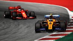 SPIELBERG, AUSTRIA - JUNE 30: Lando Norris of Great Britain driving the (4) McLaren F1 Team MCL34 Renault leads Sebastian Vettel of Germany driving the (5) Scuderia Ferrari SF90 on track during the F1 Grand Prix of Austria at Red Bull Ring on June 30, 2019 in Spielberg, Austria. (Photo by Bryn Lennon/Getty Images)