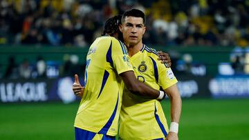 Soccer Football - Saudi Pro League - Al Nassr v Al Fateh - Al-Awwal Park, Riyadh, Saudi Arabia - January 26, 2025 Al Nassr's Mohamed Simakan reacts with Cristiano Ronaldo after the match REUTERS/Hamad I Mohammed