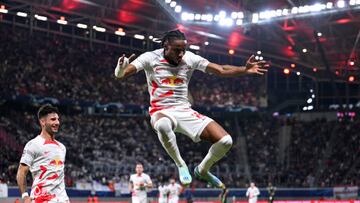 LEIPZIG, GERMANY - OCTOBER 25: Christopher Nkunku of RB Leipzig celebrates scoring their side's second goal with teammates during the UEFA Champions League group F match between RB Leipzig and Real Madrid at Red Bull Arena on October 25, 2022 in Leipzig, Germany. (Photo by Oliver Hardt - UEFA/UEFA via Getty Images,)