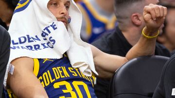 Apr 12, 2024; San Francisco, California, USA; Golden State Warriors guard Stephen Curry (30) watches his teammates from the bench during the fourth quarter against the New Orleans Pelicans at Chase Center. Mandatory Credit: D. Ross Cameron-USA TODAY Sports