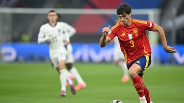 Spain's defender #03 Robin Le Normand runs with the ball during the UEFA Euro 2024 final football match between Spain and England at the Olympiastadion in Berlin on July 14, 2024. (Photo by INA FASSBENDER / AFP)