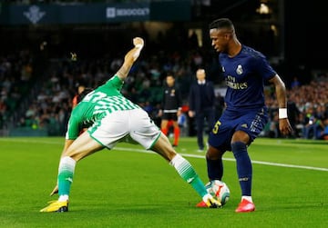 Real Madrid's Vinicius Junior in action with Real Betis' Marc Bartra.