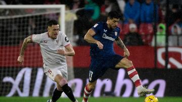 Sevilla's Argentinian forward #05 Lucas Ocampos vies with Athletic Bilbao's Spanish defender #17 Yuri Berchiche during the Spanish league football match between Sevilla FC and Athletic Club Bilbao at the Ramon Sanchez Pizjuan stadium in Seville on January 4, 2024. (Photo by CRISTINA QUICLER / AFP)