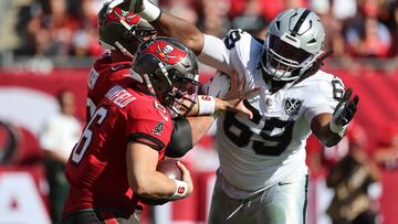 The Bucs leapfrog the Falcons at the top of NFC South after a third successive victory over the Raiders.