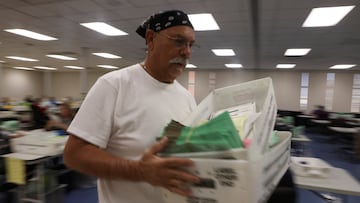 Early ballots are opened and processed before being counted ahead of the November 8, 2022 midterm election in Phoenix, Arizona.