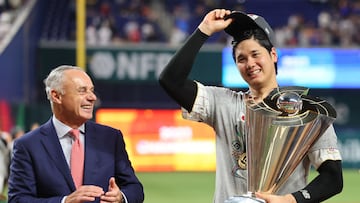 MIAMI, FLORIDA - MARCH 21: Shohei Ohtani (R) #16 of Team Japan is awarded the trophy by Commissioner of Baseball Rob Manfred (L) after defeating Team USA in the World Baseball Classic Championship at loanDepot park on March 21, 2023 in Miami, Florida.   Megan Briggs/Getty Images/AFP (Photo by Megan Briggs / GETTY IMAGES NORTH AMERICA / Getty Images via AFP)